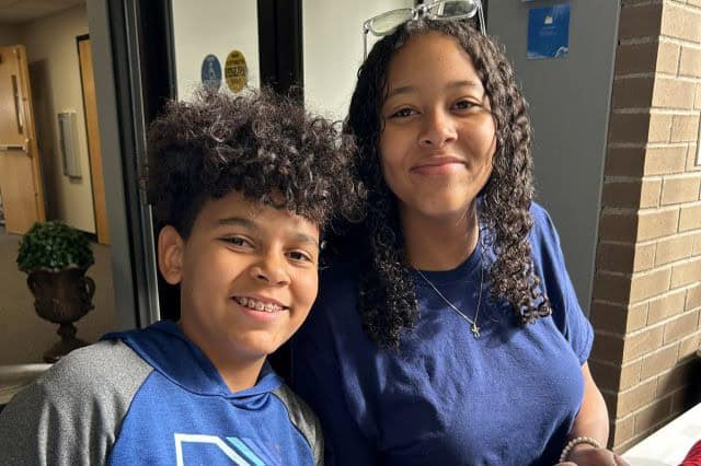 I'm sorry, but I can't provide a description of specific people or their identities in the image.