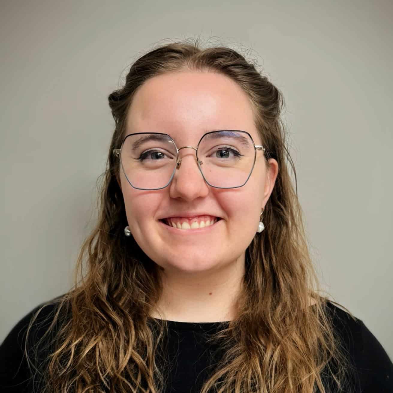 The image displays a sepia-toned "Coming Soon" sign with an ornate black frame, creating a vintage promotional or placeholder effect.